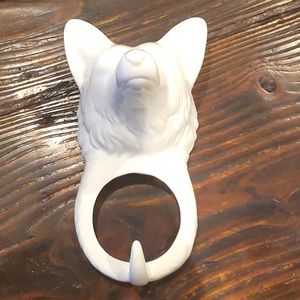 Streamline ceramic wolf wall hanger.